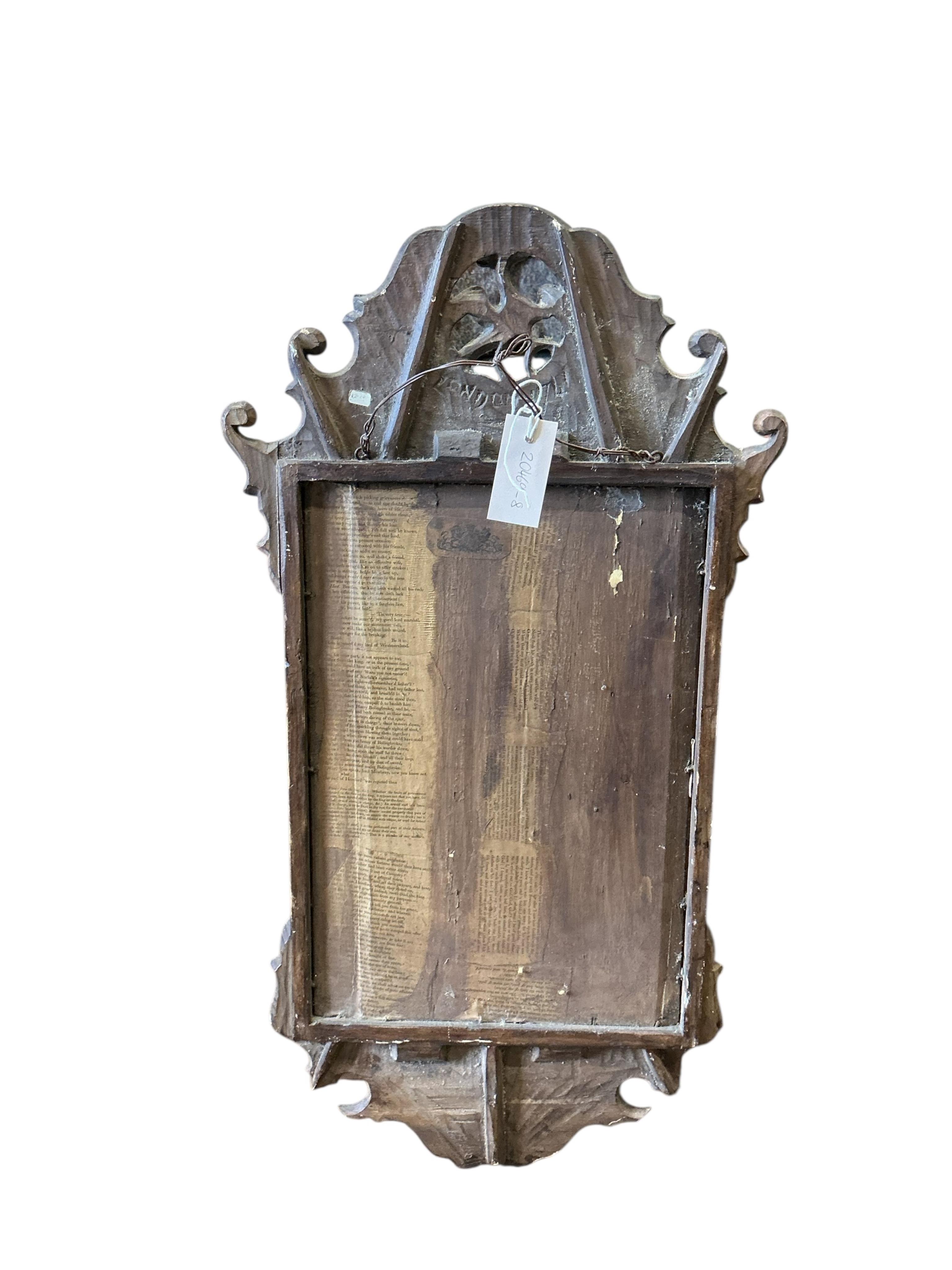An 18th century style walnut and parcel gilt fret cut wall mirror, signed London, 1741, width 42cm, height 78cm